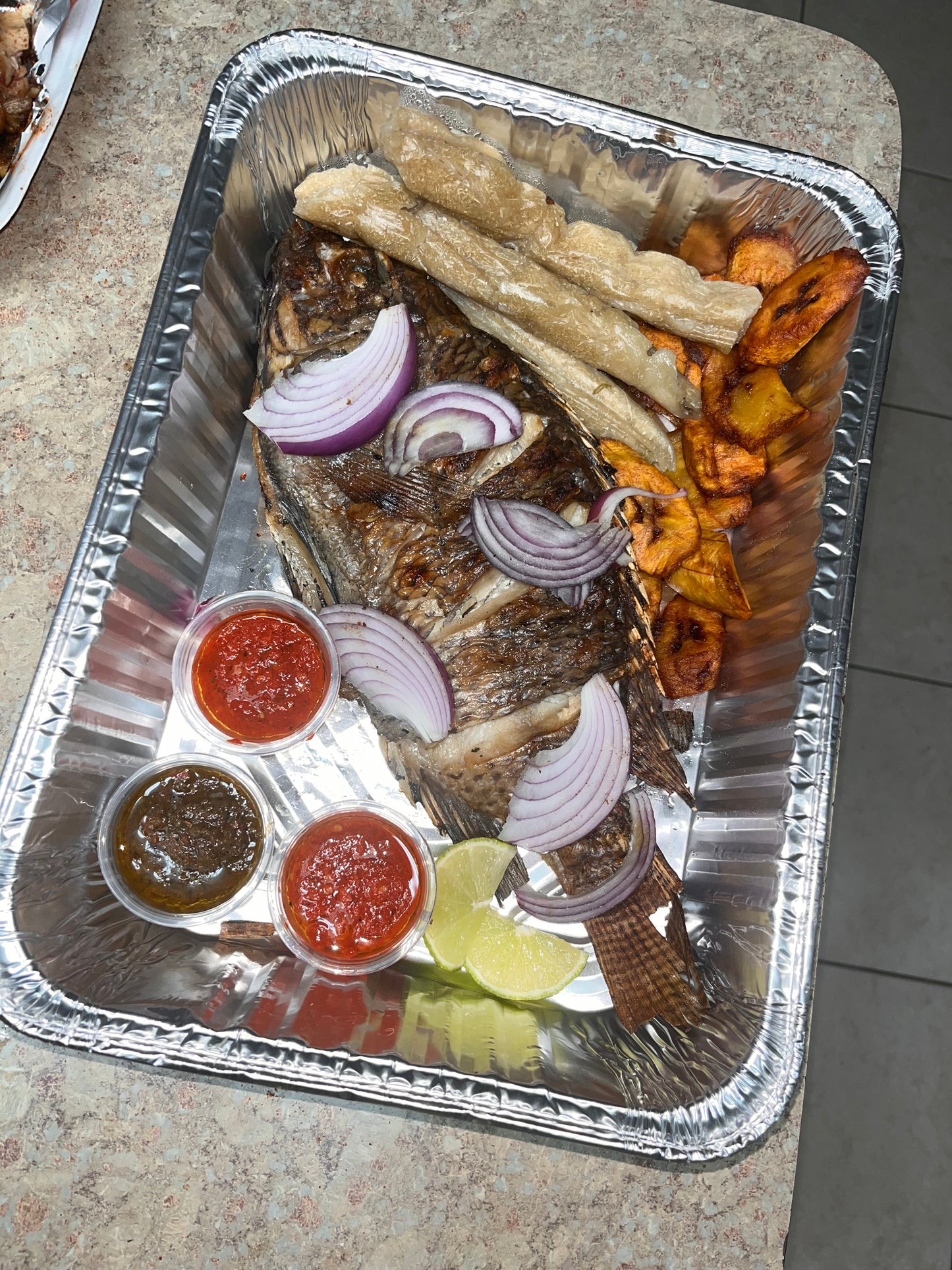 Tilapia With Plantain & Bobolo(Cassava Sticks)