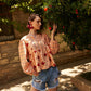 Copriandra Peplum Top