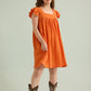 Ava's Hope Babydoll Dress In Orange