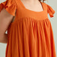 Ava's Hope Babydoll Dress In Orange