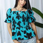 Bailey in Bold Peplum Top In Blue And Black