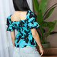 Bailey in Bold Peplum Top In Blue And Black
