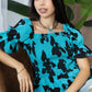 Bailey in Bold Peplum Top In Blue And Black