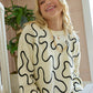 Twist of West Knitted Sweater in Canyon White