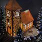 Christmas Village Church with Stained Glass Window. Illuminated House of Worship. Holiday Decor. Christmas Celebration.