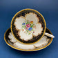Royal Stafford Cup and Saucer. Black with Gold. Hand Painted Flower Bouquet Inside of Cup and on the Plate.