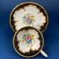 Royal Stafford Cup and Saucer. Black with Gold. Hand Painted Flower Bouquet Inside of Cup and on the Plate.