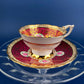Royal Stafford Cup and Saucer. Black with Gold. Hand Painted Flower Bouquet Inside of Cup and on the Plate.