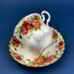 Black Cup and Saucer with Roses on White Background Inside the Cup. Royal Albert Old Country Rose Tea Set. Hand Painted Pink & Red Roses.