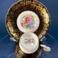 Royal Stafford Cup and Saucer. Black with Gold. Hand Painted Flower Bouquet Inside of Cup and on the Plate.