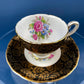 Royal Stafford Cup and Saucer. Black with Gold. Hand Painted Flower Bouquet Inside of Cup and on the Plate.
