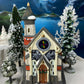 Christmas Village Church with Stained Glass Window. Illuminated House of Worship. Holiday Decor. Christmas Celebration.