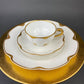 Antique Bavarian Porcelain Tea Trio. Winterling Roslaw. Cup, Saucer, and Dessert Plate in Gold and Pink. Modern Lotus Pattern.