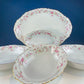 Antique Porcelain Serving Dishes. Set of Five Hutschenreuter Platters and Bowls with Pink Rose Garlands Motif.