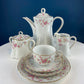 Antique Hutschenreuther Porcelain Coffee Set. Coffee or Teapot, Sugar Jar, Creamer, 2 8" Dessert Plates, & 6 Tea Cups/Saucers. Floral Motif.