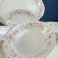 Antique Porcelain Serving Dishes. Set of Five Hutschenreuter Platters and Bowls with Pink Rose Garlands Motif.