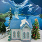 Christmas Village Cedar Valley Chapel Towne Series. Illuminated Blue Church with Stained Glass Window. Santa's Workbench. Night Light.
