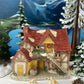 Christmas Village Farm House with Red Roof. Illuminated Building Holiday Decoration.