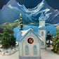 Christmas Village Cedar Valley Chapel Towne Series. Illuminated Blue Church with Stained Glass Window. Santa's Workbench. Night Light.