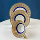 Antique Bavarian Porcelain Tea Trio. Z and Co, Tirschenreuther. Cup, Saucer, and Dessert Plate in Rich Gold and Blue. Modern Floral Pattern.
