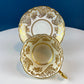 White and Gold Cup and Saucer. Paragon Porcelain, By Appointment to Her Majesty the Queen Potters. Dining Room Cabinet Display.