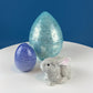 Set of Two Glass Eggs. Large Textured Blue and Smaller Purple with Swirl Embedded in Glass. Easter or Spring Decor. Dining Room Decor.