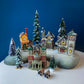 Christmas Village Collection of Small Illuminated Houses. Set of 4 Bldgs: Mill, 2 Churches, Train St., Council Offices, 2 Sheep and 3 Pines.