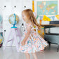 Class Act Flutter Sleeve Twirl Dress